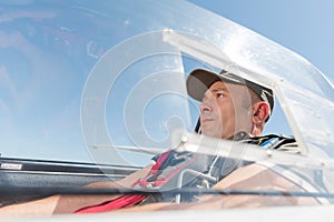 Man in glider cockpit