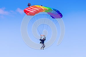 Man gliding down on a parachute