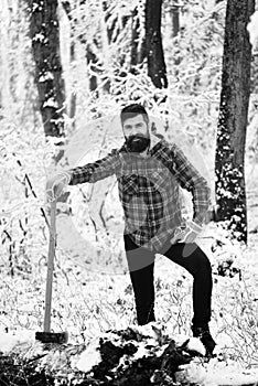 Man with gloves in forest. Macho with beard and mustache