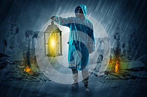 Man with a glowing lantern at a catastrophe scene