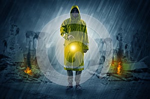 Man with a glowing lantern at a catastrophe scene