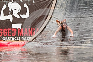 Man Goes Headfirst Down Water Slide In Obstacle Course Race