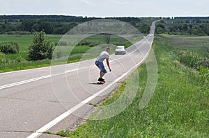 Man goes on skateboard on route