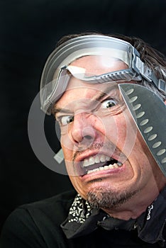 Man In Goggles With Knife, Afraid