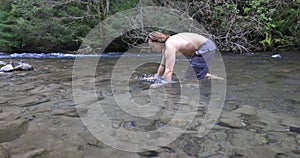 Man going for a cold dip in the Umpqua River