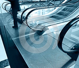 Man going down the escalator