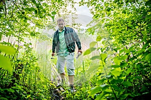 Man going through forest