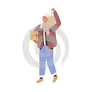 Man going with holiday gift and shopping bag. Happy person walking and holding Christmas present box. Young guy carrying