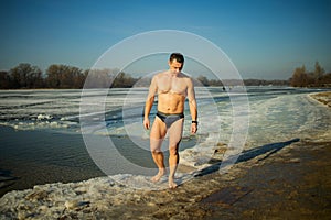 Man Going To Swim In The Winter Lake In The Ice Hole