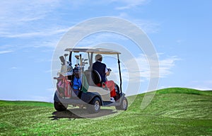 A man on the golf course with a golf cart