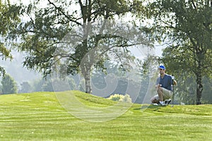 Man on Golf Course Playing Golf - Horizontal