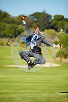 Man, golf and jump for celebration, excited face or portrait for winning, achievement or goal outdoor. African