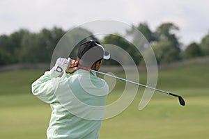 Man golf swing at practice