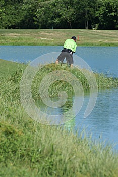 Man Golfing out of the Rough