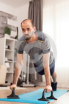 Man in good physical shape doing push ups