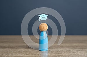 A man with a graduate cap symbol, the concept of getting an education and graduating from training.