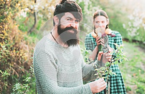 Man Graft branch. Portrait of pair of farms Working In Garden Together. Earth concept. Earth day. Farming gardening and