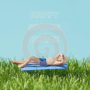 Man on the grass and text happy spring break