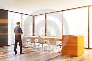 Man in gray panoramic dining room