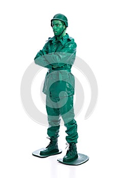 Man on a green toy soldier costume