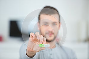 Man with green usb pen