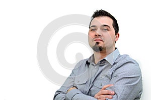 Man in Grey Shirt and Crossed Arms looking Confident Copyspace