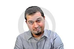 Man in Grey Shirt looking skeptical on white backdrop