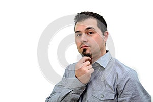 Man in Grey Shirt Stroking Chin on white backdrop