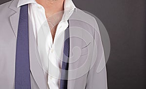 Man in a grey suit, close-up