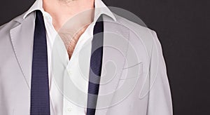 Man in a grey suit, close-up