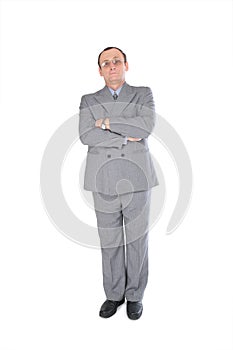 Man in grey suit stands