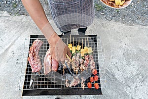 A man is grilling on the barbecue