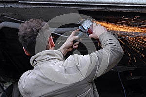 Man grinding his car photo
