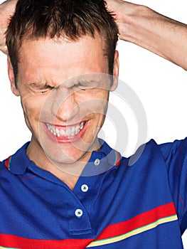 Man grinning and pulling hair out in studio