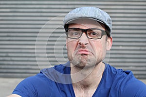 Man with a grumpy expression