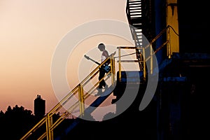 Man with guitar at dusk photo