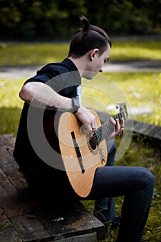 Stylish man with guitar photo