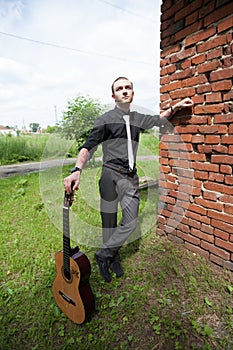 Stylish man with guitar photo