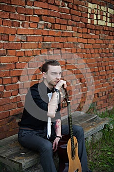 Stylish man with guitar photo