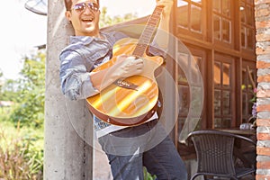 Man and guitar outdoor relax concepts vintage style