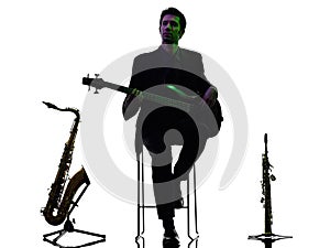 Man guitarist bassist player playing silhouette photo