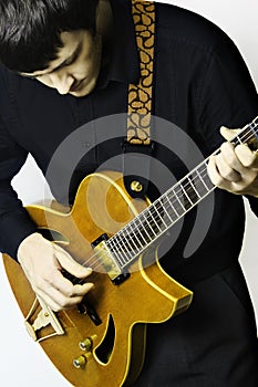 Man guitarist with electric guitar playing.