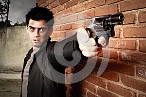 Man with gun in an alley