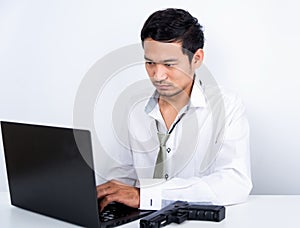 Man and gun hacking laptop computer