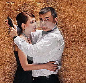 Man with gun protecting his woman