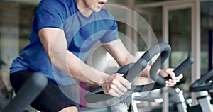 Man In The Gym  Exercising and Training On Bicycle