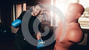 Man In Gym Is Training Shots With A Box Maneken photo