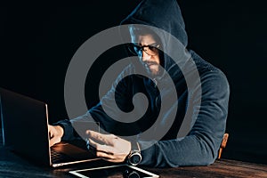 Man hacking bank card using computer system
