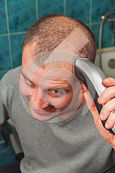 Man with hair clipper