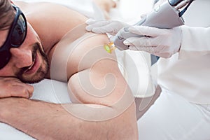 Man in a hair removal studio